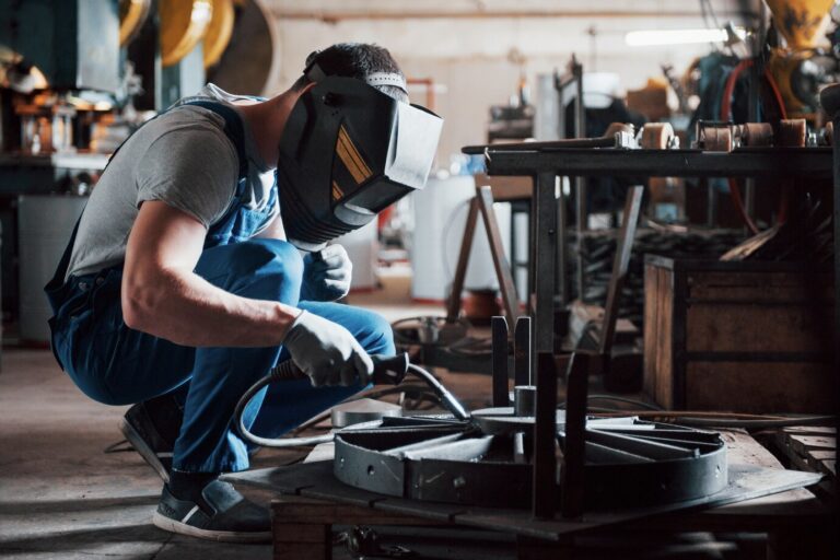 portrait-young-worker-large-metalworking-plant_146671-19574